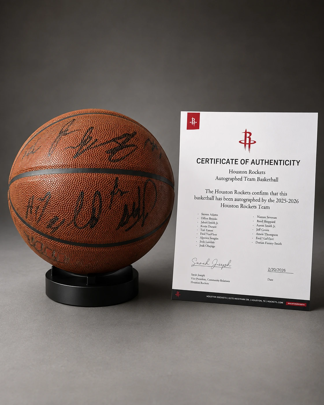 Houston Rockets team-signed basketball displayed beside a certificate document