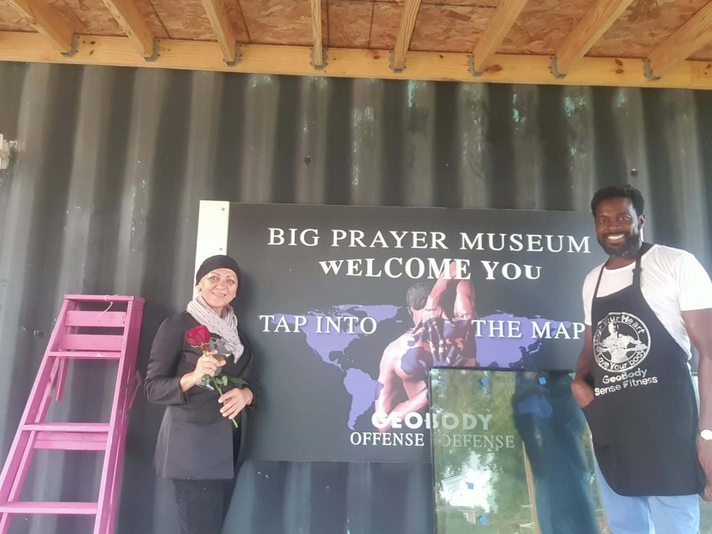 People engaging with Big Prayer Museum materials at the museum site